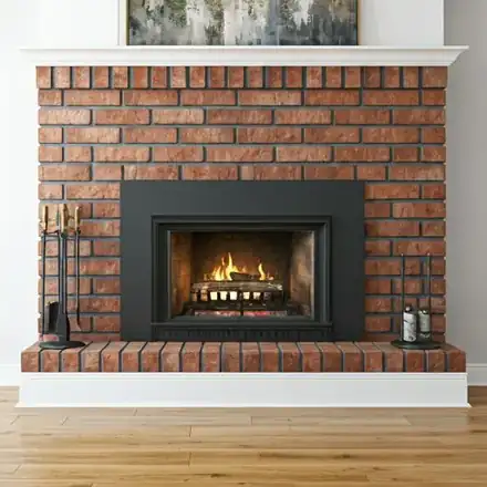 Interior shot of a clean, soot-free fireplace hearth after a professional Level 2 chimney sweep
