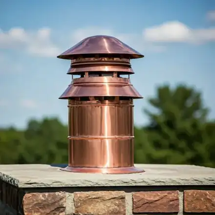 Close up shot of a custom-fabricated decorative copper chimney cap