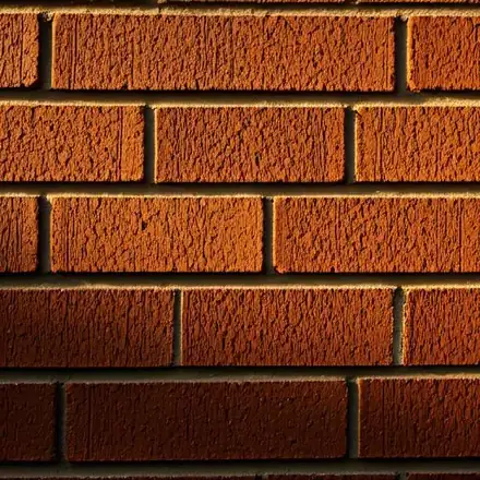 Close-up architectural photography of a masterfully tuckpointed exterior brick wall